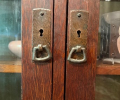 Detail original hand hammered copper door pulls with functioning locks.